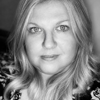 Black-and-white close-up portrait of Debbie McMoneagle