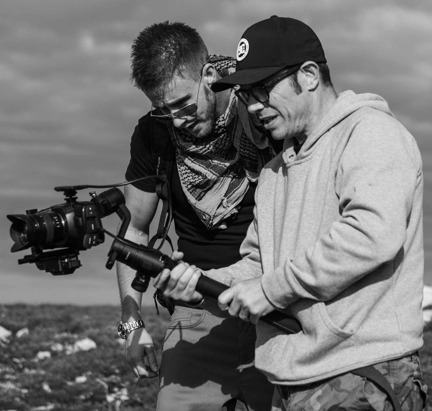 Ash Dykes reviewing a shot with a camera operator on location