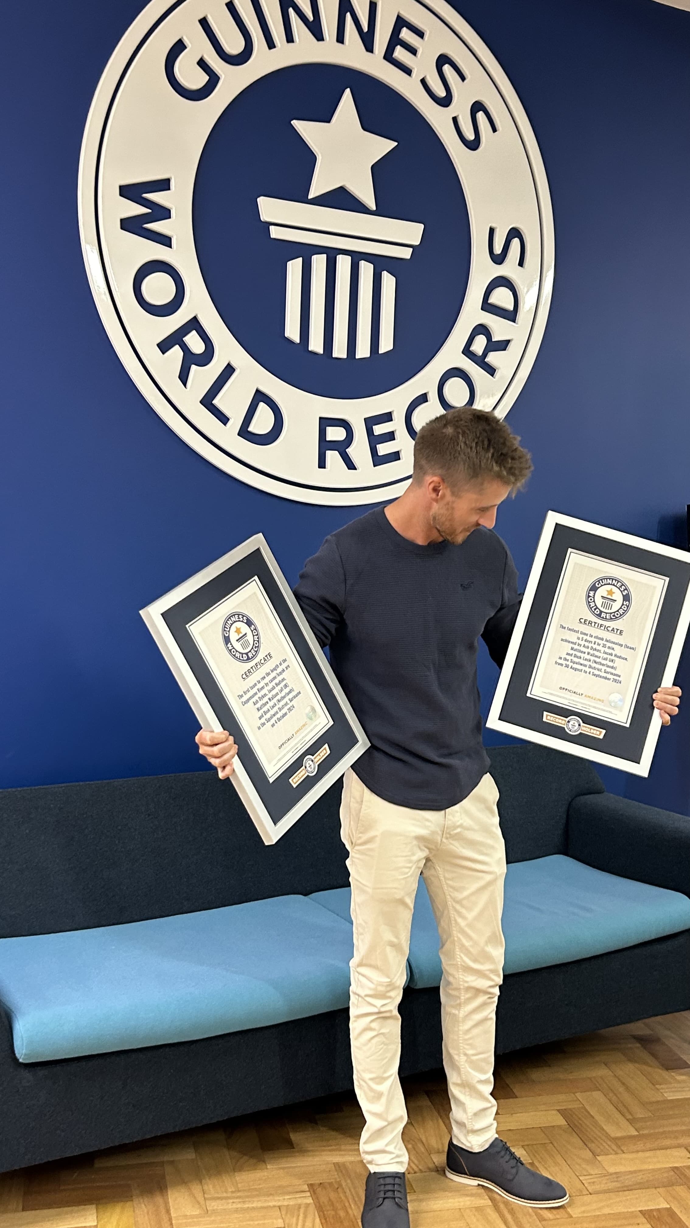 Ash Dykes at Guinness World Records headquarters with certificates