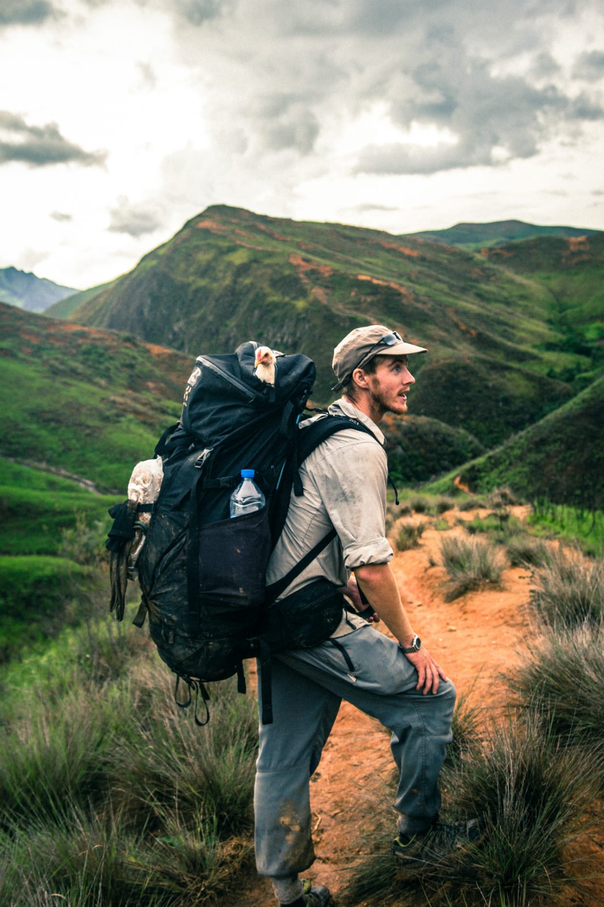 Ash Dykes on a highland ridge in Madagascar carrying a heavily loaded pack
