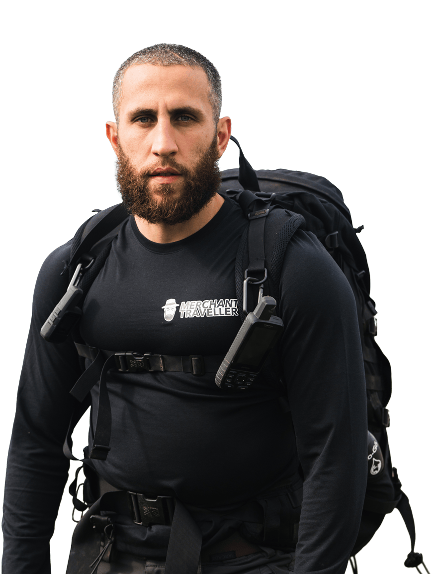 Daniel Eggington in expedition kit, carrying a loaded pack