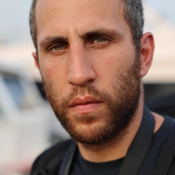 close-up outdoor portrait of a bearded man facing the camera