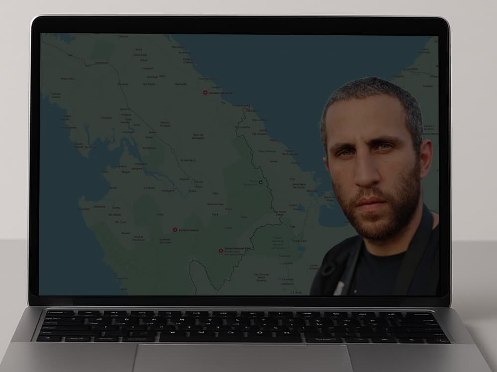 composite graphic on a laptop screen showing a map overlay with a man's portrait